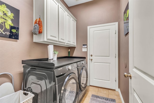 15604 Christopher Ln, Frisco, TX 75035 - washroom with separate washer and dryer, light tile patterned floors, cabinet space, and baseboards