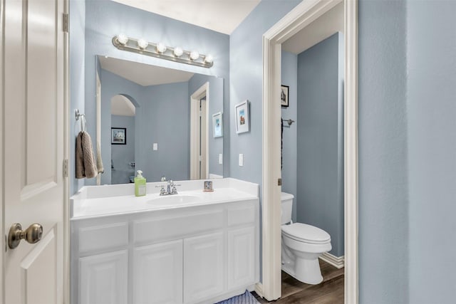 15604 Christopher Ln, Frisco, TX 75035 - bathroom featuring wood finished floors, toilet, and vanity