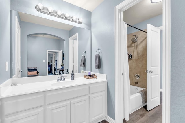 15604 Christopher Ln, Frisco, TX 75035 - full bathroom with wood finished floors, vanity, and bathing tub / shower combination