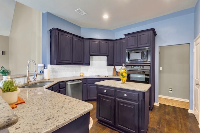 15604 Christopher Ln, Frisco, TX 75035 - kitchen featuring wall oven, a sink, dishwasher, black microwave, and light stone counters