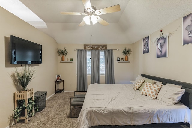 bedroom with baseboards, carpet flooring, a ceiling fan, and vaulted ceiling
