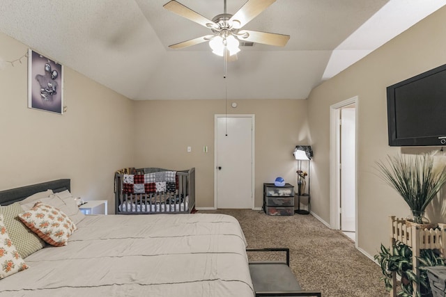 bedroom featuring a ceiling fan, baseboards, carpet, and vaulted ceiling