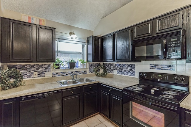 kitchen with a sink, light countertops, a textured ceiling, tasteful backsplash, and black appliances