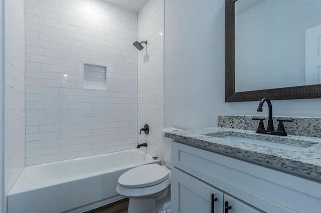 bathroom featuring shower / bath combination, wood finished floors, toilet, and vanity