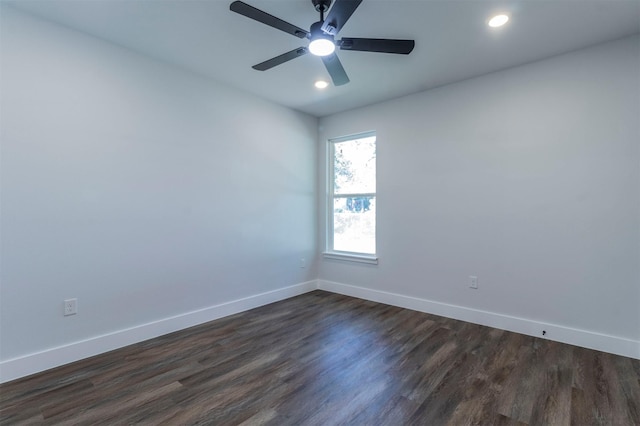 spare room with baseboards, a ceiling fan, dark wood-type flooring, and recessed lighting