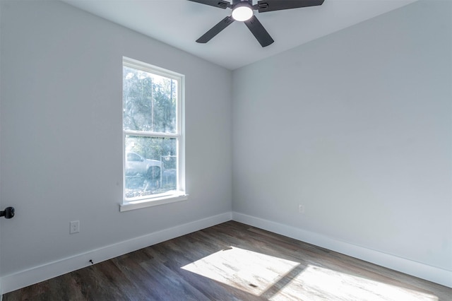 unfurnished room with baseboards, ceiling fan, and wood finished floors
