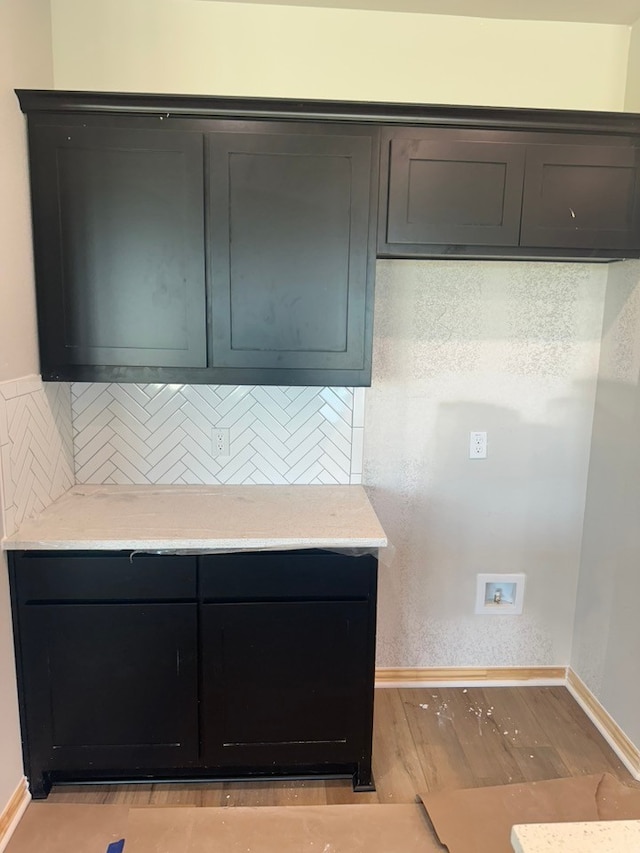 2471 Blackjack Oak Rd, Oak Ridge, TX 75161 - kitchen with baseboards, light countertops, and light wood-type flooring