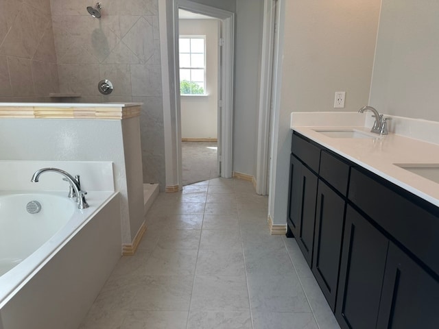 2471 Blackjack Oak Rd, Oak Ridge, TX 75161 - full bath featuring a walk in shower, a garden tub, baseboards, tile patterned flooring, and double vanity