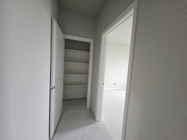 hall with concrete floors