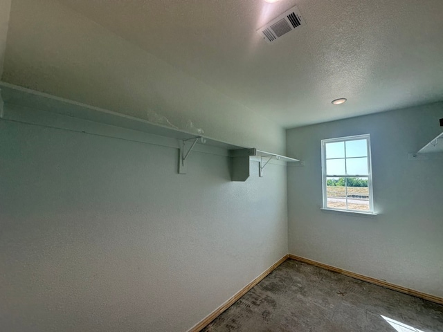 2471 Blackjack Oak Rd, Oak Ridge, TX 75161 - walk in closet featuring carpet flooring