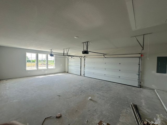 2471 Blackjack Oak Rd, Oak Ridge, TX 75161 - garage with a garage door opener and electric panel