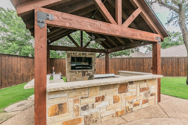 view of patio / terrace featuring a gazebo, area for grilling, and ceiling fan