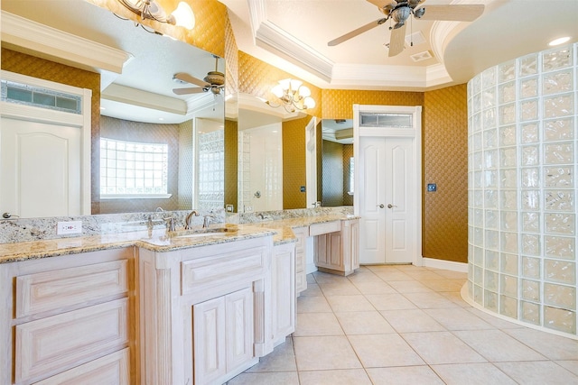 bathroom with ornamental molding, wallpapered walls, tile patterned floors, a tray ceiling, and ceiling fan with notable chandelier