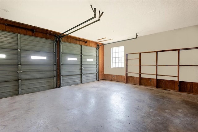 garage featuring wooden walls