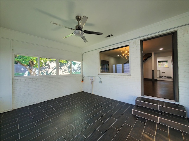 unfurnished sunroom with visible vents and a notable chandelier