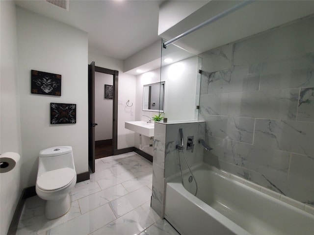bathroom featuring baseboards, marble finish floor, visible vents, and toilet