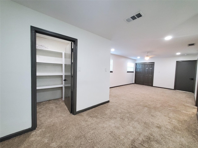 below grade area with recessed lighting, baseboards, visible vents, and carpet