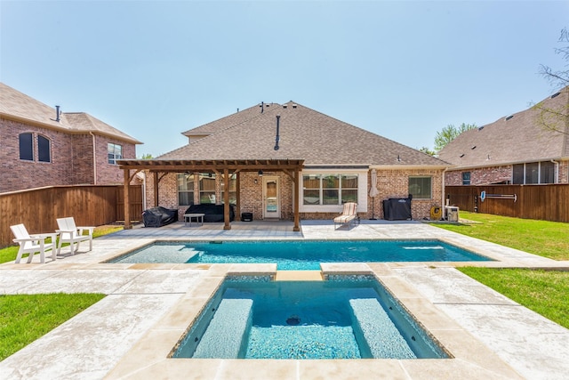 4001 Bamberg Ln, Fort Worth, TX 76244 - view of swimming pool with a lawn, a pool with connected hot tub, a fenced backyard, and a patio area