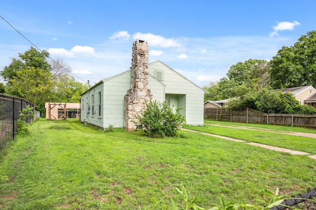 view of outbuilding featuring a fenced backyard