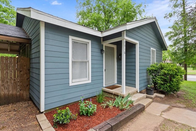 view of front of house featuring fence