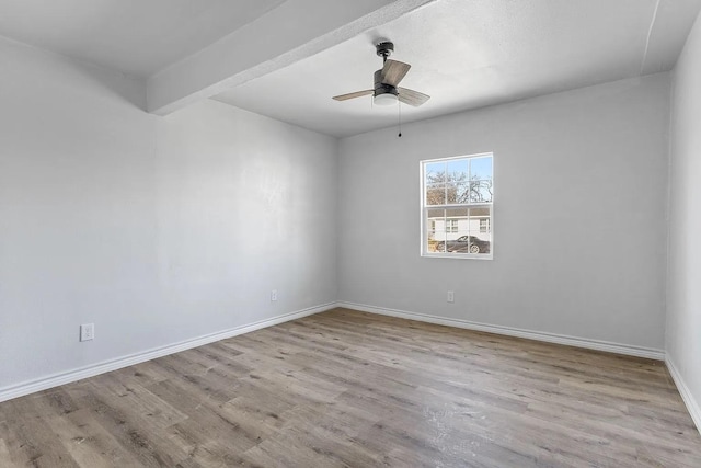 unfurnished room featuring baseboards, a ceiling fan, and wood finished floors