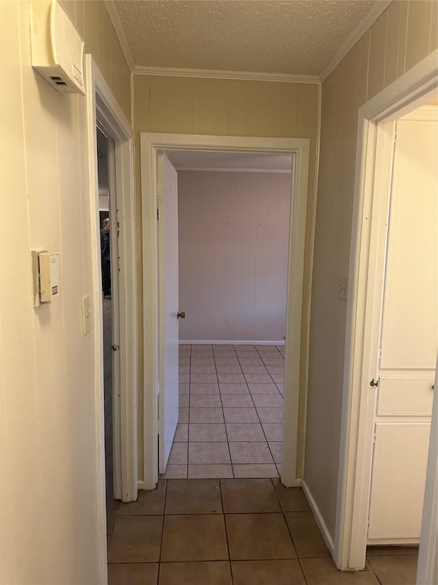 202 S Spencer St, Mart, TX 76664 - hall featuring crown molding, light tile patterned floors, and baseboards