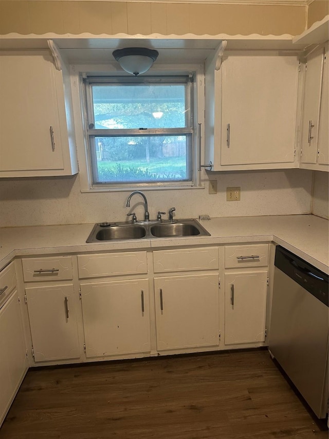 202 S Spencer St, Mart, TX 76664 - kitchen with white cabinets, light countertops, a sink, and dishwasher