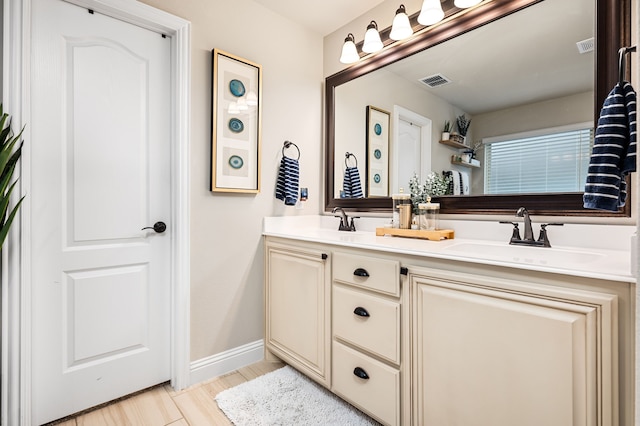 1617 Mack Ln, Little Elm, TX 75068 - full bath with double vanity, baseboards, and wood finished floors
