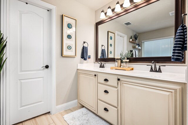 1617 Mack Ln, Little Elm, TX 75068 - full bath with double vanity, baseboards, and wood finished floors