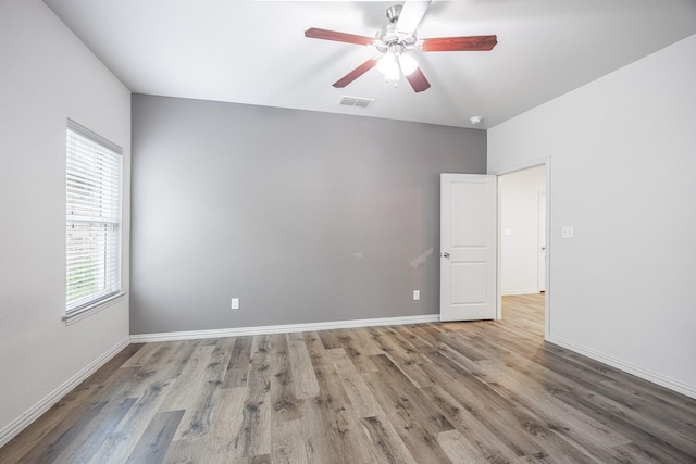 2801 17th St, Fort Worth, TX 76106 - empty room featuring visible vents, a ceiling fan, baseboards, and wood finished floors