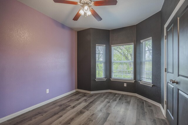 2801 17th St, Fort Worth, TX 76106 - unfurnished room with a ceiling fan, baseboards, and wood finished floors