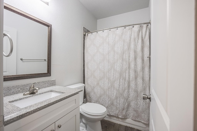 2801 17th St, Fort Worth, TX 76106 - bathroom with toilet, wood finished floors, and vanity