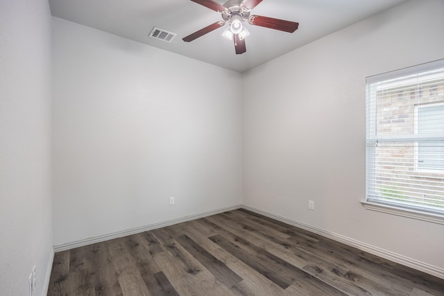 2801 17th St, Fort Worth, TX 76106 - unfurnished room with visible vents, baseboards, ceiling fan, and dark wood-style floors