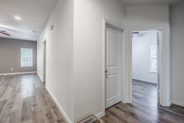 2801 17th St, Fort Worth, TX 76106 - hall with baseboards, visible vents, and wood finished floors