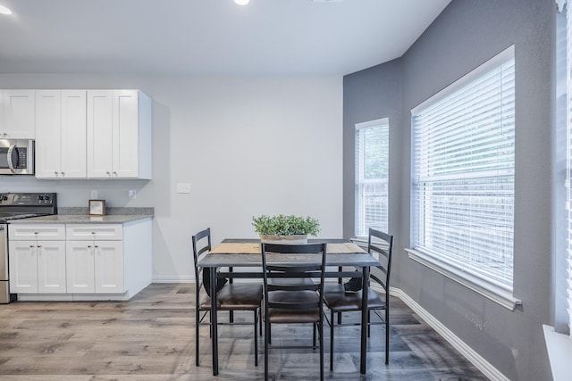 2801 17th St, Fort Worth, TX 76106 - dining area with recessed lighting, baseboards, plenty of natural light, and light wood finished floors