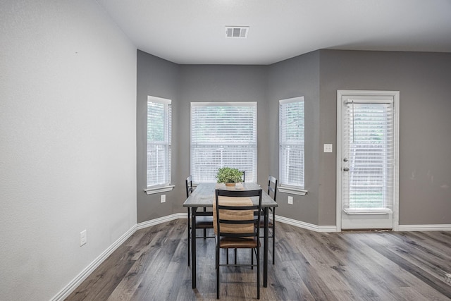 2801 17th St, Fort Worth, TX 76106 - dining area featuring baseboards, visible vents, and dark wood-type flooring
