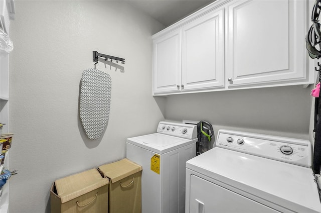 141 Walnut St, Paradise, TX 76073 - laundry room with washer and clothes dryer and cabinet space