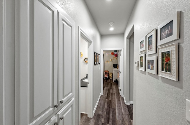 141 Walnut St, Paradise, TX 76073 - corridor featuring a textured wall, dark wood-style flooring, baseboards, and recessed lighting