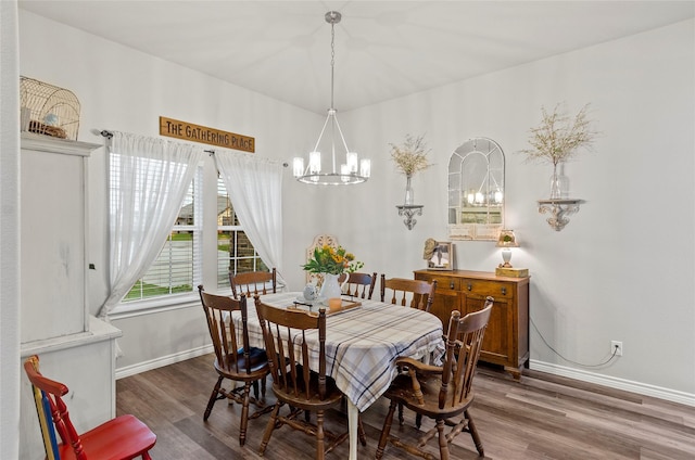 141 Walnut St, Paradise, TX 76073 - dining room featuring a chandelier, baseboards, and wood finished floors
