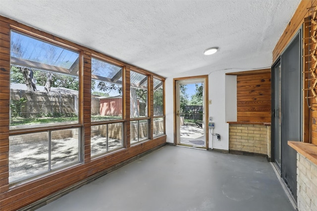 1038 Oak Hurst Dr, Grapevine, TX 76051 - unfurnished sunroom featuring concrete floors and a textured ceiling