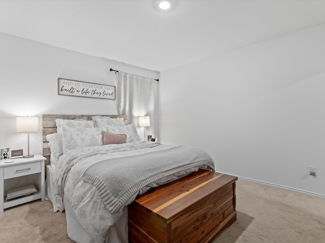 bedroom with light colored carpet