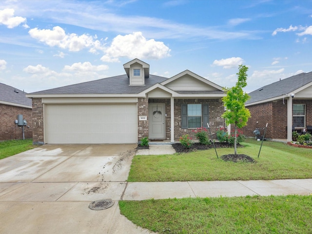 603 Vicksburg Dr, Ennis, TX 75119 - view of front of home with an attached garage, a front yard, concrete driveway, and brick siding