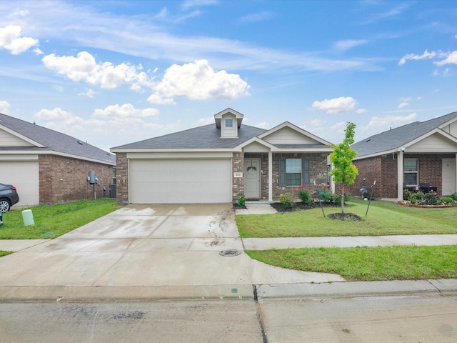 ranch-style house featuring an attached garage, driveway, brick siding, and a front yard