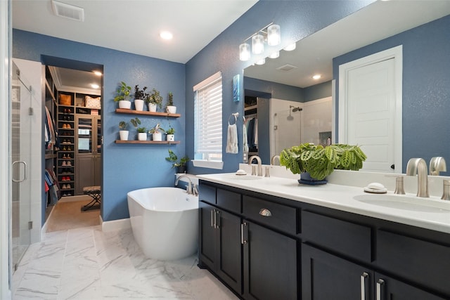 1500 Ranger Rd, Aubrey, TX 76227 - bathroom with a stall shower, a freestanding tub, double vanity, a walk in closet, and recessed lighting