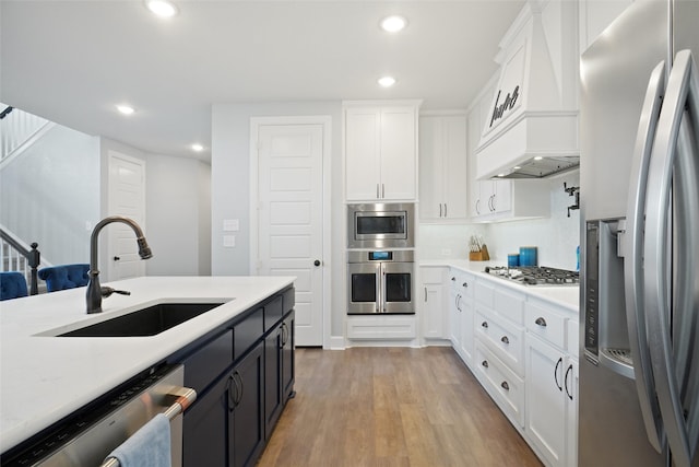 1500 Ranger Rd, Aubrey, TX 76227 - kitchen featuring appliances with stainless steel finishes, a sink, recessed lighting, white cabinets, and light countertops