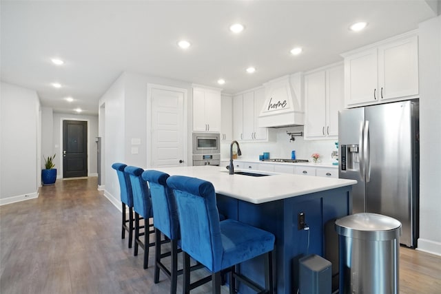 1500 Ranger Rd, Aubrey, TX 76227 - kitchen with appliances with stainless steel finishes, a sink, custom exhaust hood, baseboards, and recessed lighting