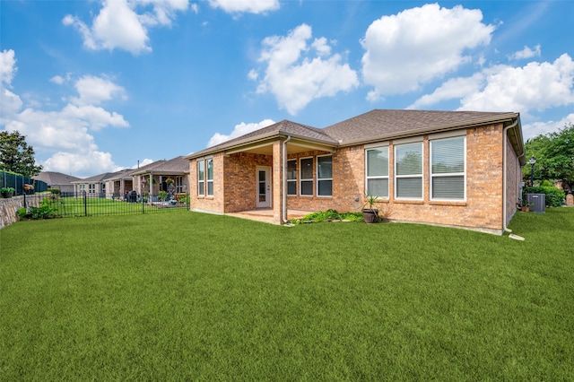 1130 Pasatiempo Dr, Frisco, TX 75036 - back of house with brick siding, central AC, and a patio