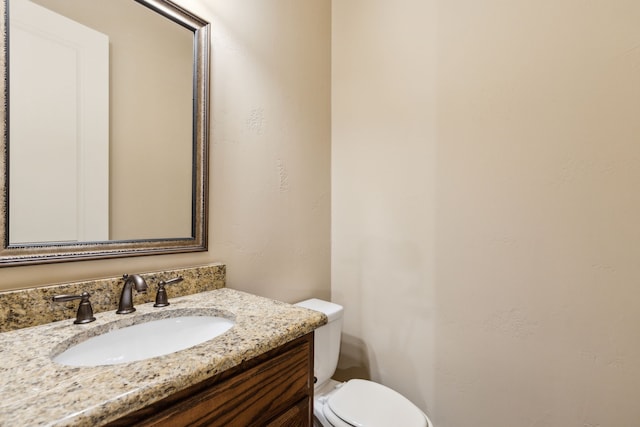 5924 Heron Bay Ln, Mckinney, TX 75070 - half bathroom featuring vanity and toilet