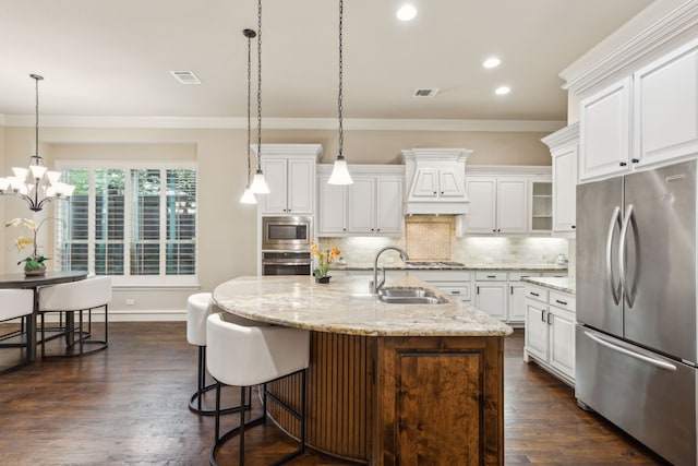 5924 Heron Bay Ln, Mckinney, TX 75070 - kitchen with appliances with stainless steel finishes, a sink, custom exhaust hood, ornamental molding, and backsplash