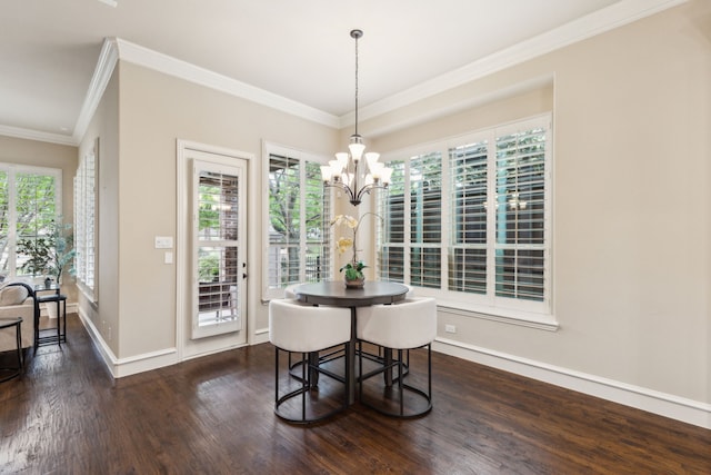5924 Heron Bay Ln, Mckinney, TX 75070 - dining area with baseboards, an inviting chandelier, ornamental molding, and dark wood-type flooring